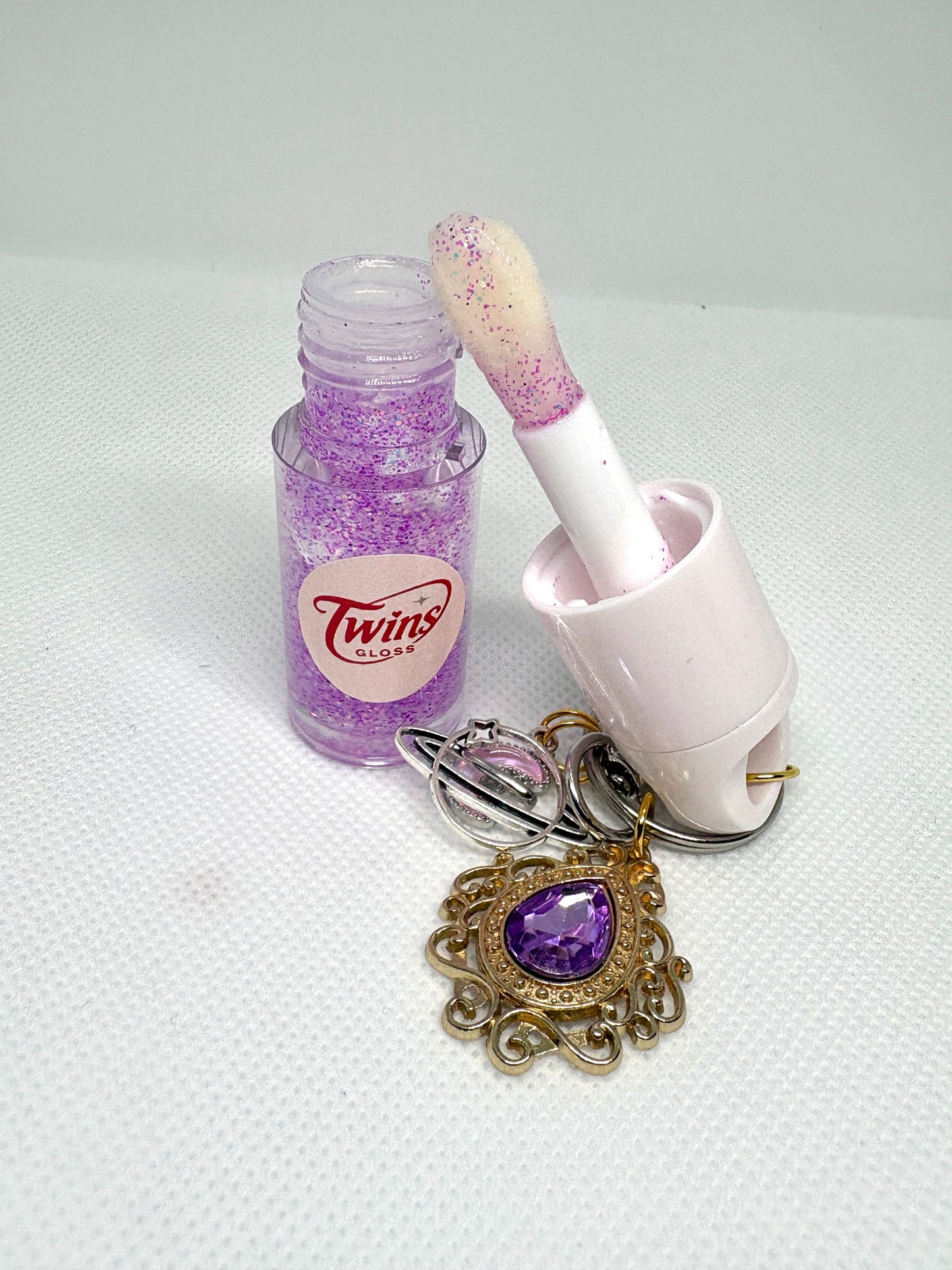 Gloss de géminis  sabor a melón