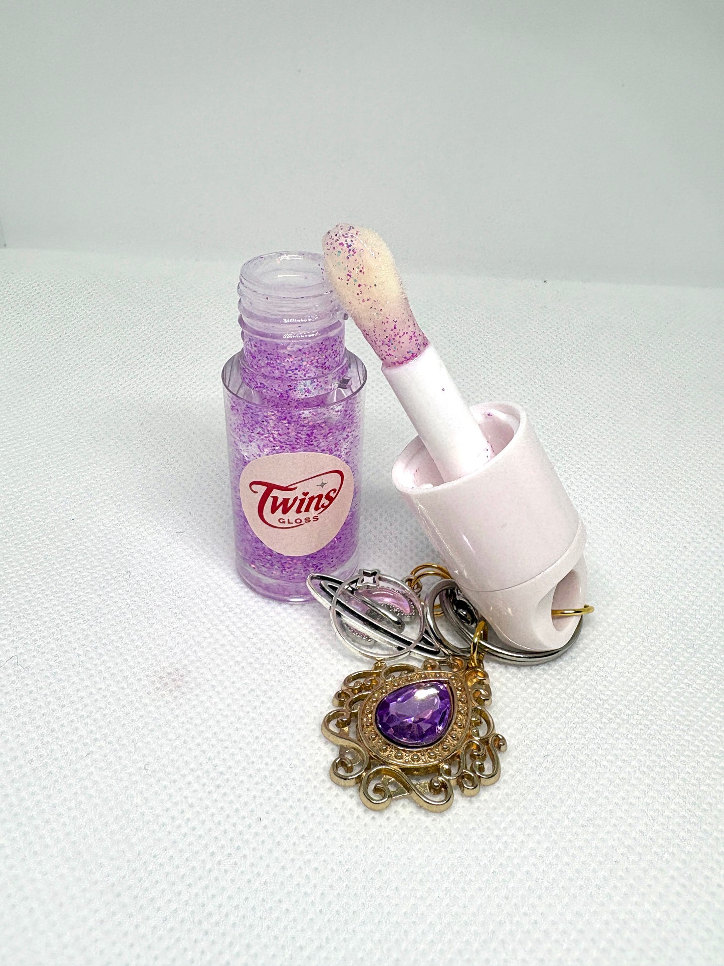 Gloss de géminis  sabor a melón